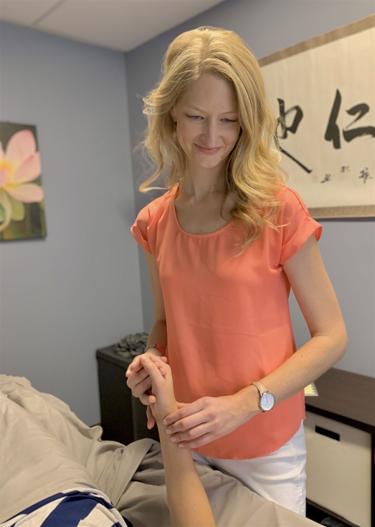 Autumn Jensen, L.Ac., treating a patient during an acupuncture session at Key Element Acupuncture in Westminster, Colorado, serving the north Denver metro